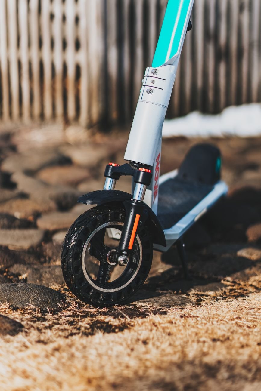 Close-up of an electric scooter on a rocky path in Reykjavík, Iceland.